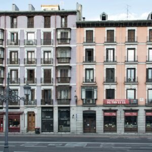 a tall building sitting on the side of a street